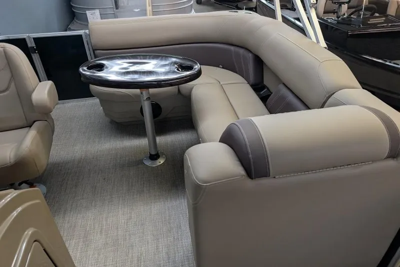 Slide: The Image of Interior of 2026 Sylvan Mirage Fish 818 Fish boat with beige seating and table. - 5