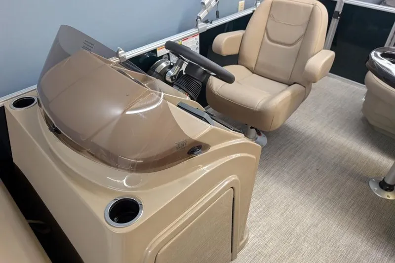 Slide: The Image of 2026 Sylvan Mirage Fish 818 Fish boat interior with steering console and captain's chair. - 6