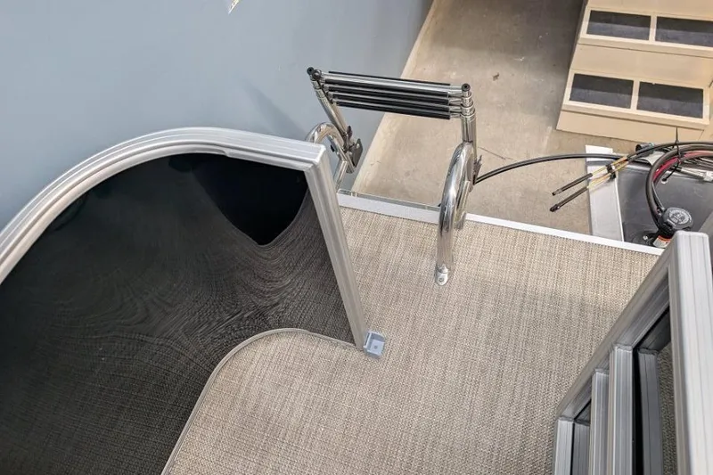 Slide: The Image of 2026 Sylvan Mirage Fish 818 Fish boat interior with ladder and carpeted flooring. - 8