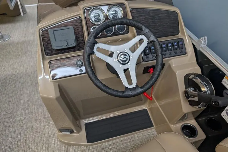 Slide: The Image of 2026 Sylvan Mirage Fish 818 Fish boat dashboard with steering wheel and controls. - 9