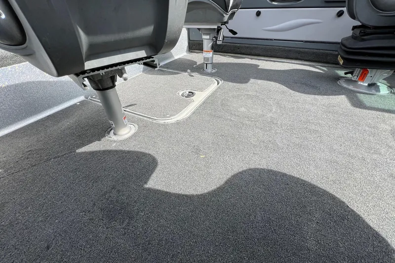 Slide: The Image of Interior view of 2012 Lund 208 Pro-V GL boat with carpeted flooring and adjustable seats. - 10