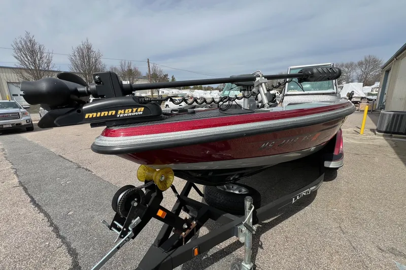 Slide: The Image of 2012 Lund 208 Pro-V GL boat with Minn Kota Terrova motor on trailer. - 14