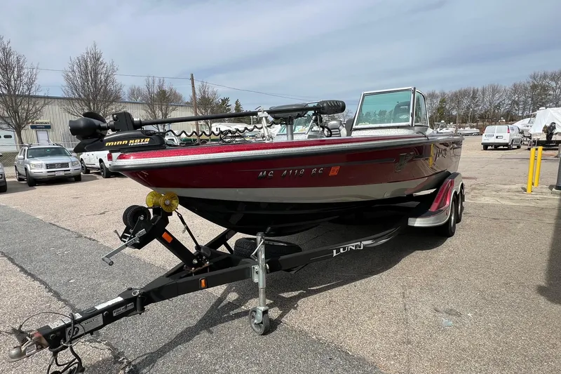 Slide: The Image of 2012 Lund 208 Pro-V GL boat on trailer in parking lot. - 6