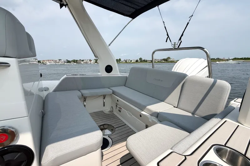 Slide: The Image of 2026 Zodiac Medline 7.5 boat interior with comfortable seating and scenic water view. - 8