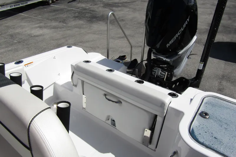 Slide: The Image of 2024 Wellcraft 223 Fisherman boat with Mercury engine, featuring seating and storage area. - 16