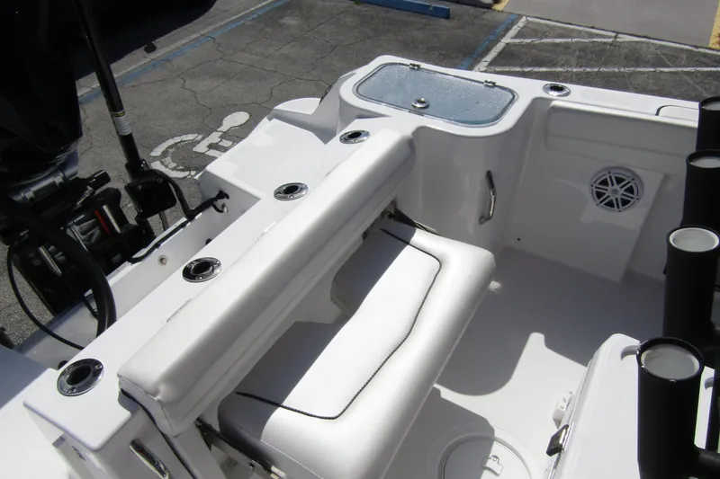 Slide: The Image of 2024 Wellcraft 223 Fisherman boat interior with seating and fishing rod holders. - 17