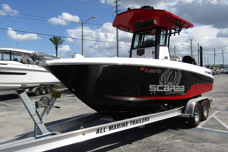 Slide: The Image of 2024 Wellcraft 223 Fisherman boat on trailer, featuring Scarab Offshore design. - 6