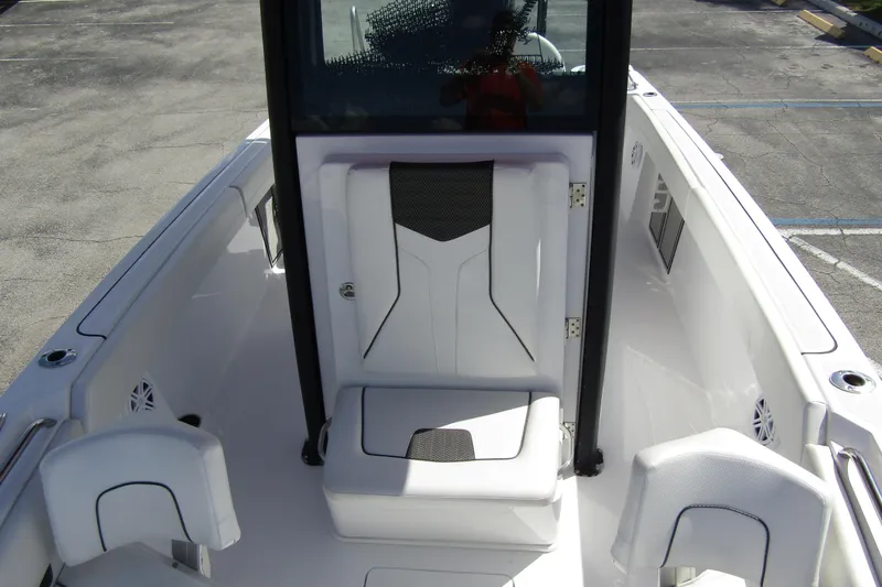 Slide: The Image of 2024 Wellcraft 223 Fisherman boat interior with white seating and modern design. - 8