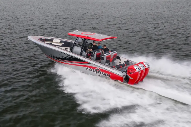 The Image of 2021 Fountain 38 SC boat speeding on water with triple outboard engines. - 0