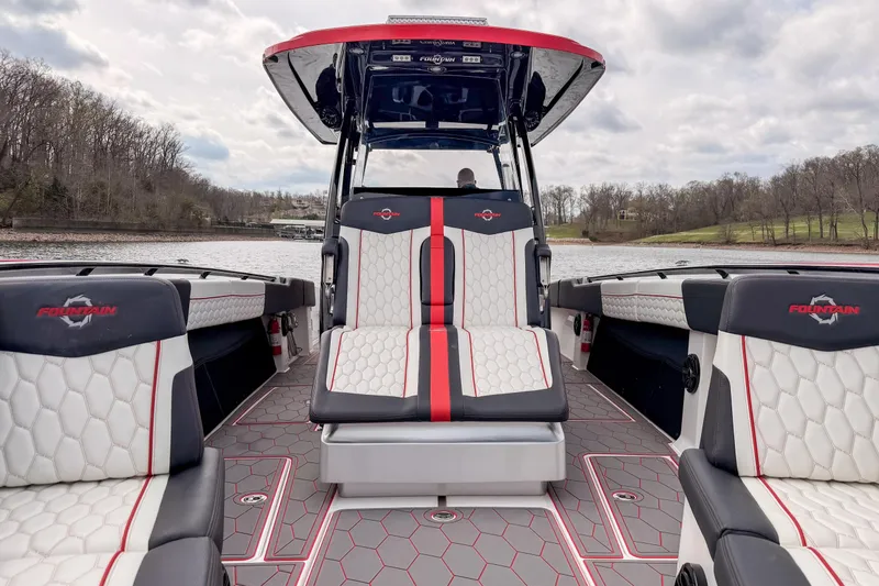 Slide: The Image of 2021 Fountain 38 SC boat interior with stylish seating and scenic lake view. - 20