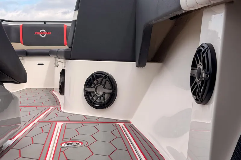 Slide: The Image of Interior of 2021 Fountain 38 SC boat with speakers and stylish seating. - 25
