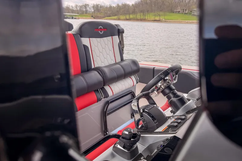 Slide: The Image of Interior view of 2021 Fountain 38 SC boat with steering wheel and seating. - 27