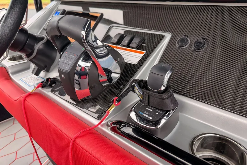 Slide: The Image of Control panel of a 2021 Fountain 38 SC boat with carbon fiber finish. - 29