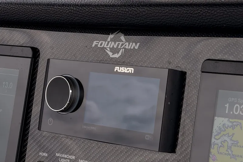 Slide: The Image of Dashboard of 2021 Fountain 38 SC boat featuring Fusion audio system. - 30