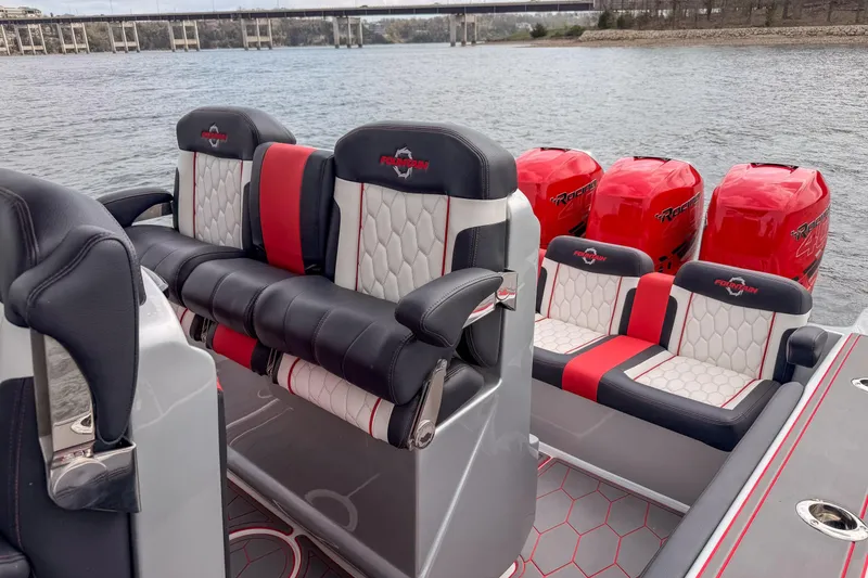 Slide: The Image of 2021 Fountain 38 SC boat interior with stylish seating and powerful outboard engines. - 36