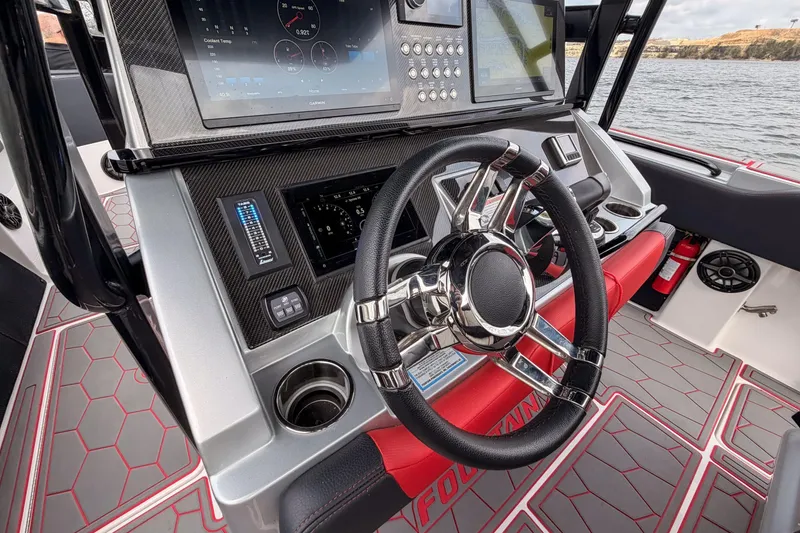 Slide: The Image of Cockpit of 2021 Fountain 38 SC boat with modern steering and navigation system. - 38
