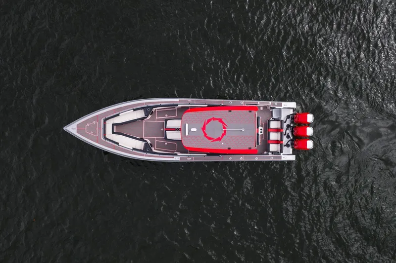 Slide: The Image of Aerial view of 2021 Fountain 38 SC boat with red accents on water. - 4