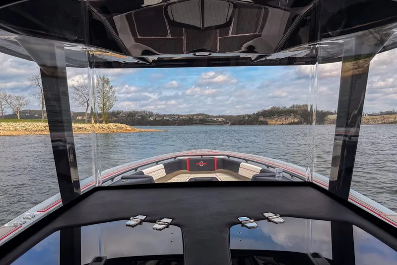 Slide: The Image of 2021 Fountain 38 SC boat on a scenic lake with clear skies. - 45