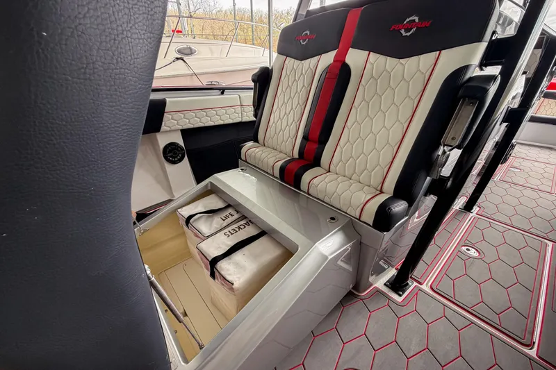 Slide: The Image of 2021 Fountain 38 SC boat interior with stylish seating and life jacket storage. - 47