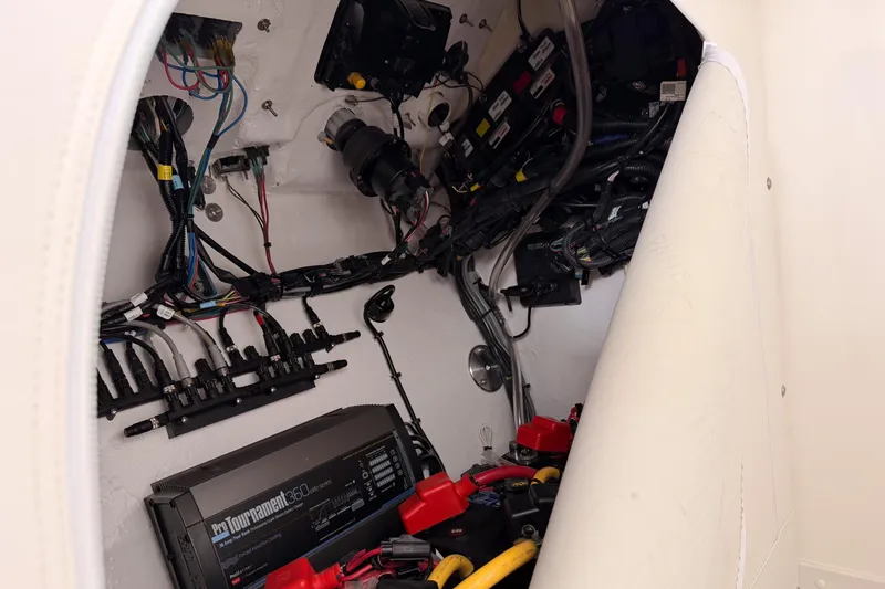 Slide: The Image of Electrical system inside a 2021 Fountain 38 SC boat, showcasing wiring and components. - 50