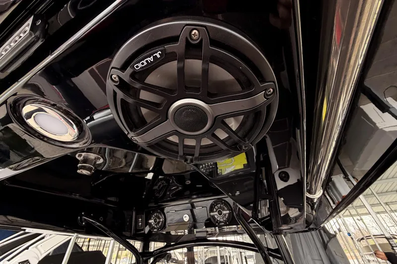 Slide: The Image of JL Audio speaker system on 2021 Fountain 38 SC boat, featuring sleek black design. - 52