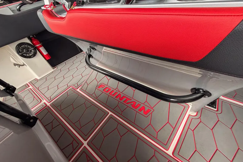 Slide: The Image of Interior of 2021 Fountain 38 SC boat with red accents and branded flooring. - 53