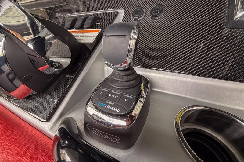 Slide: The Image of Control panel of 2021 Fountain 38 SC boat with joystick and carbon fiber finish. - 54