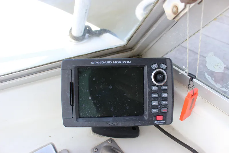 Slide: The Image of Standard Horizon GPS device on 1979 Tripp Angler 22 Flush Deck Cuddy boat. - 13