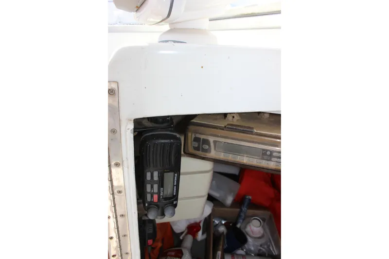 Slide: The Image of Interior of 1979 Tripp Angler 22 Flush Deck Cuddy with radio equipment. - 14