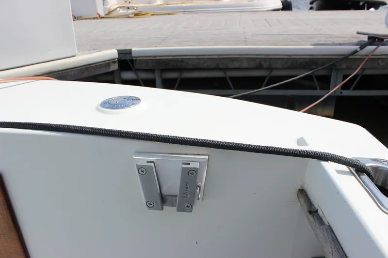 Slide: The Image of 1979 Tripp Angler 22 Flush Deck Cuddy boat detail at dockside. - 24