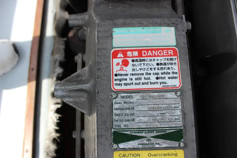 Slide: The Image of Warning label on a 1979 Tripp Angler 22 Flush Deck Cuddy engine. - 26