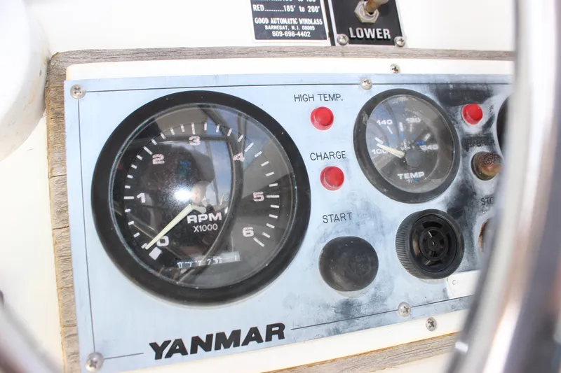 Slide: The Image of 1979 Tripp Angler 22 Flush Deck Cuddy dashboard with Yanmar RPM and temperature gauges. - 27