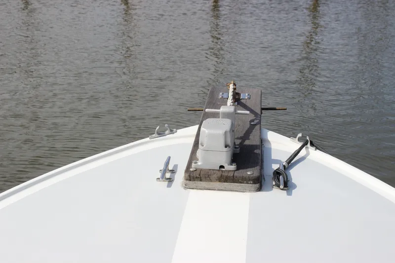 Slide: The Image of Bow of 1979 Tripp Angler 22 Flush Deck Cuddy on calm water. - 29