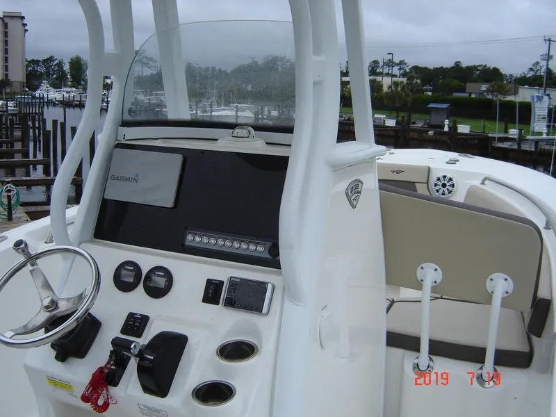Slide: The Image of 2018 Tidewater 232 LXF boat console with controls and electronics. - 5