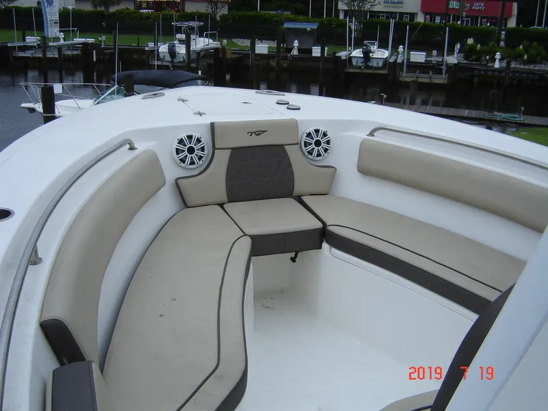 Slide: The Image of Interior view of a 2018 Tidewater 232 LXF boat with seating area. - 8