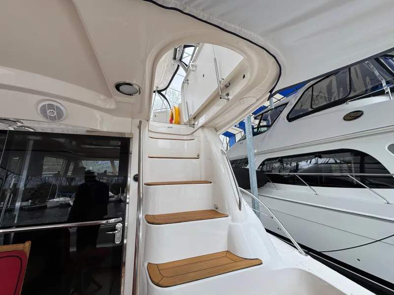 Slide: The Image of Staircase on 2007 Sea Ray 58 Sedan Bridge yacht, leading to upper deck. - 12