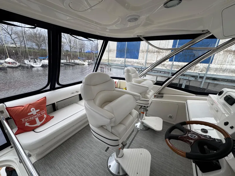 Slide: The Image of Luxurious 2007 Sea Ray 58 Sedan Bridge interior with plush seating and helm. - 14