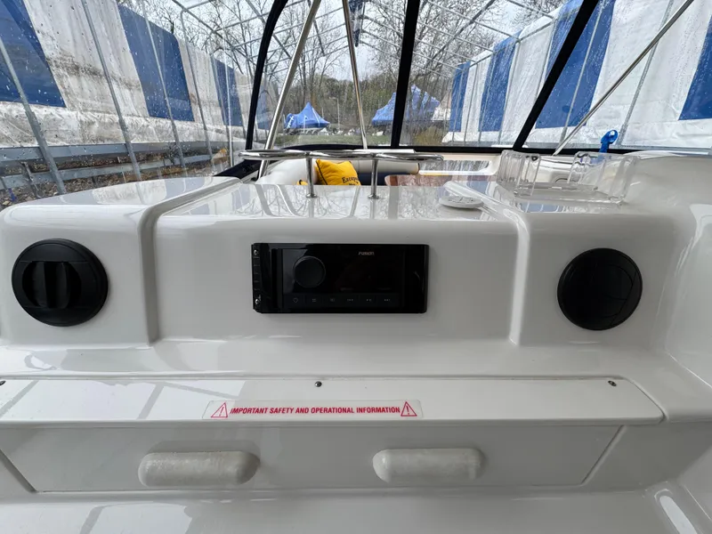 Slide: The Image of 2007 Sea Ray 58 Sedan Bridge dashboard with stereo system and safety information. - 18