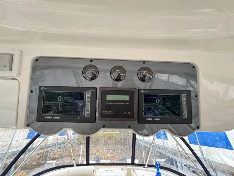 Slide: The Image of Control panel of a 2007 Sea Ray 58 Sedan Bridge yacht with navigation displays. - 19