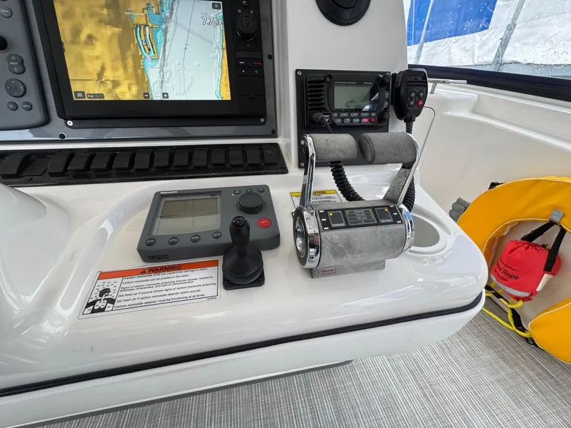 Slide: The Image of Control panel of a 2007 Sea Ray 58 Sedan Bridge yacht with navigation equipment. - 23