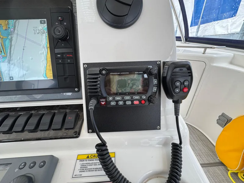 Slide: The Image of Control panel of a 2007 Sea Ray 58 Sedan Bridge with navigation and communication equipment. - 24