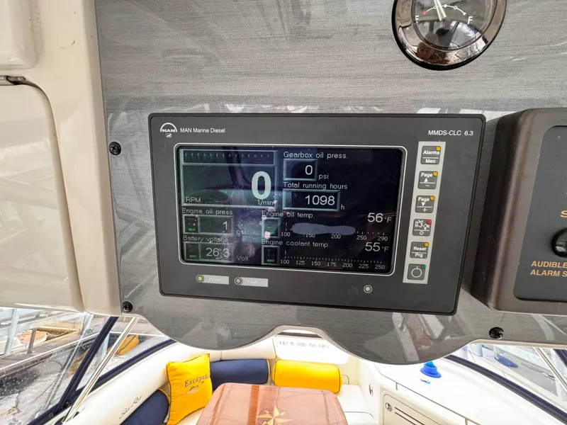 Slide: The Image of 2007 Sea Ray 58 Sedan Bridge dashboard with digital display showing engine metrics. - 25