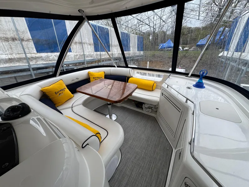 Slide: The Image of Luxurious 2007 Sea Ray 58 Sedan Bridge interior with plush seating and elegant table. - 27