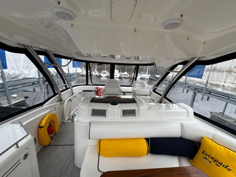 Slide: The Image of 2007 Sea Ray 58 Sedan Bridge interior with seating and panoramic windows. - 29