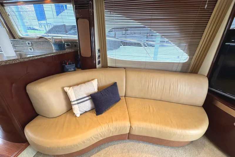 Slide: The Image of Luxurious interior of 2007 Sea Ray 58 Sedan Bridge with beige leather sofa. - 38