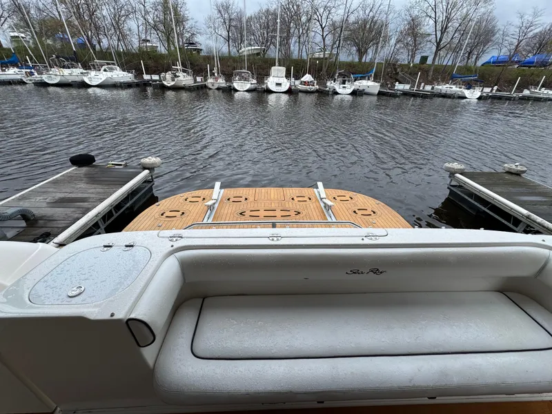 Slide: The Image of 2007 Sea Ray 58 Sedan Bridge yacht at dock, view of stern and swim platform. - 4
