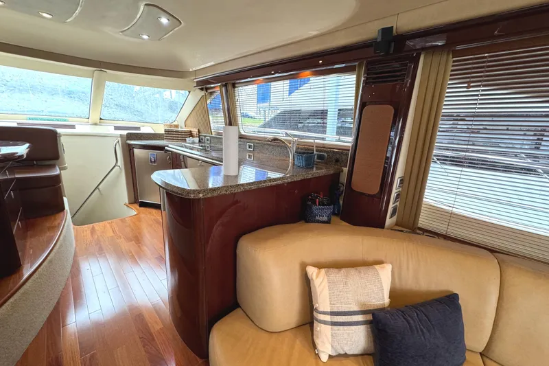 Slide: The Image of Luxurious interior of 2007 Sea Ray 58 Sedan Bridge yacht with modern kitchen and seating area. - 41