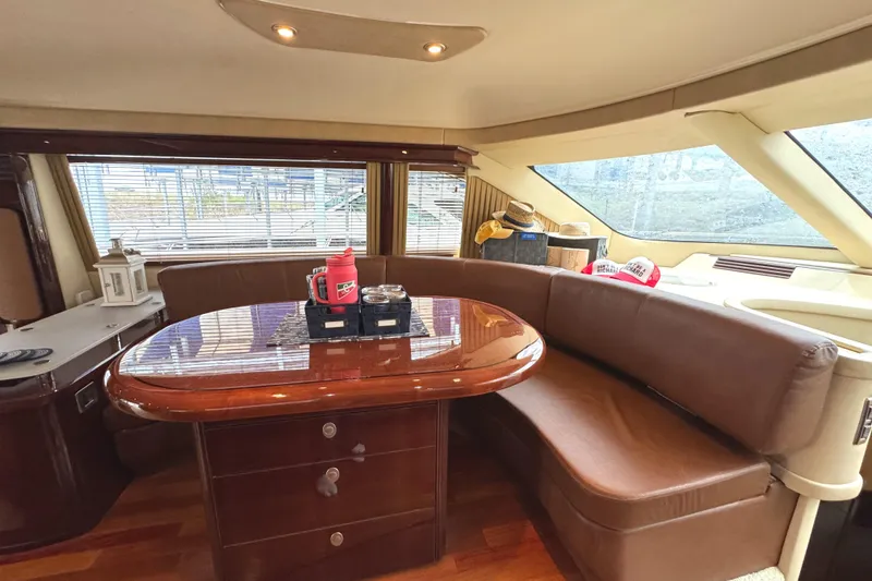 Slide: The Image of Luxurious interior of 2007 Sea Ray 58 Sedan Bridge yacht with elegant dining area. - 43