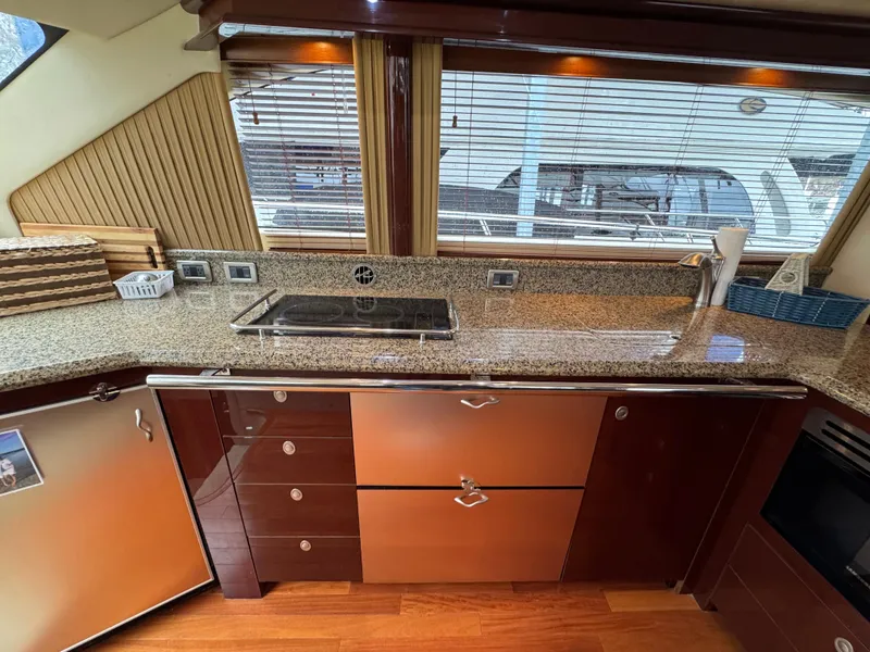 Slide: The Image of Luxurious kitchen interior of 2007 Sea Ray 58 Sedan Bridge yacht with modern appliances. - 45
