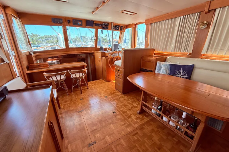 Slide: The Image of Interior of a 1992 Grand Banks 46 Classic yacht with wooden furnishings and helm. - 10